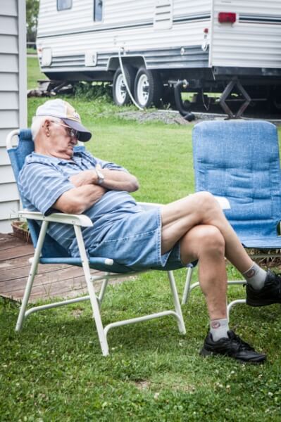 Man sleeping in camp chair